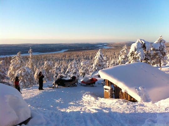 Snowmobile safari through Lappish forest