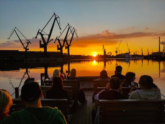 Sunset on the shipyard and old town cruise in Gdansk